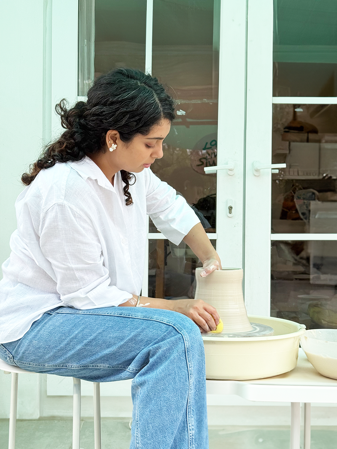 Akanksha with her ceramic work